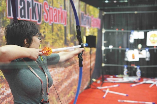 A shooter takes aim at the fun and entertaining Marky Sparky booth. 