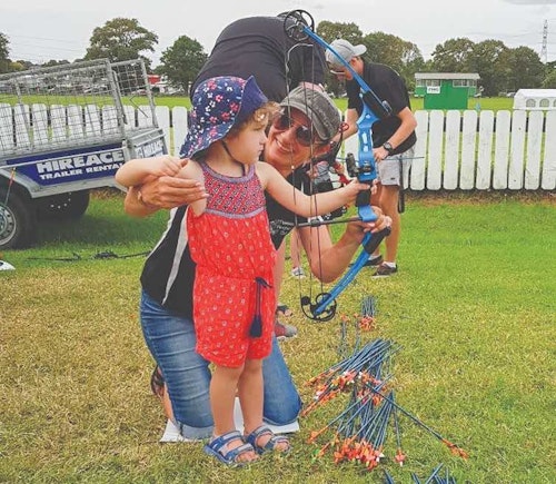 Engage with females of all ages and encourage their interest in the sport early by offering archery at different events. (Photo courtesy of Attitude Archery.)